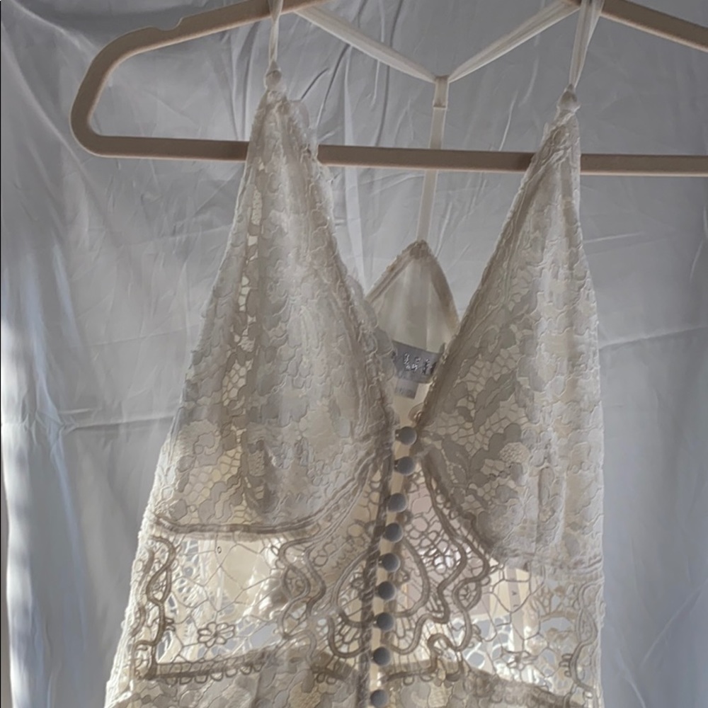 White lace, floor length dress.